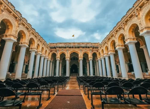 Thirumalai Nayakkar Mahal massive white circular pillars and the grand central courtyard of the 17th-century Indo-Saracenic palace in Madurai