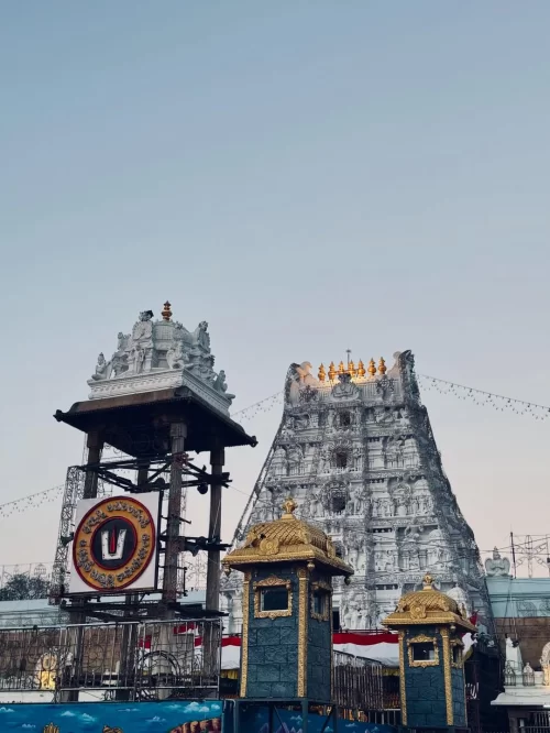 Sri Venkateswara Temple complex at Tirupati, Andhra Pradesh, showcasing the ornate white gopuram and sacred emblem tower, a revered pilgrimage site included in Andhra Pradesh tour packages.