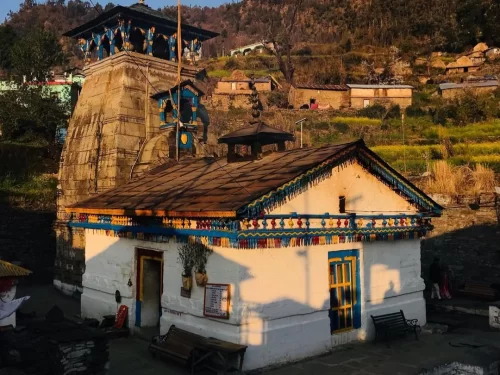 Triyuginarayan Temple near Guptkashi, Uttarakhand showcasing traditional Himalayan architecture against a scenic village backdrop, a sacred wedding site of Lord Shiva and Parvati included in Uttarakhand tour packages