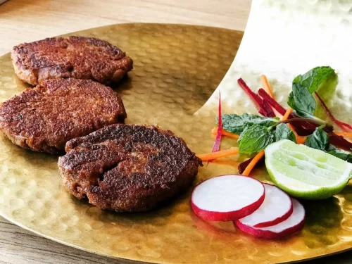 Taj Mahal at Agra during sunset, featuring water reflections, perfect romantic experience Uttar Pradesh tour package.