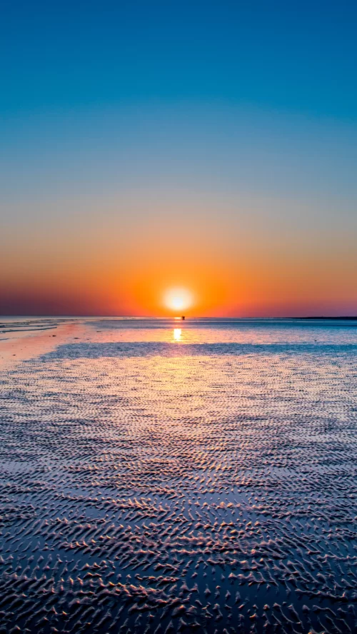Mesmerizing sunset over the white desert near Bhuj Gujarat with vibrant sky and textured salt flats creating a stunning landscape featured in Gujarat tour packages