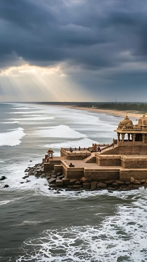 Somnath Temple in Gujarat overlooking the Arabian Sea with dramatic clouds and ocean waves creating a divine coastal view featured in Gujarat tour packages