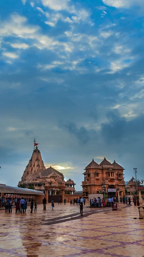 Devotees visiting Somnath Temple in Gujarat during evening hours with grand temple complex and spiritual ambiance featured in Gujarat tour packages