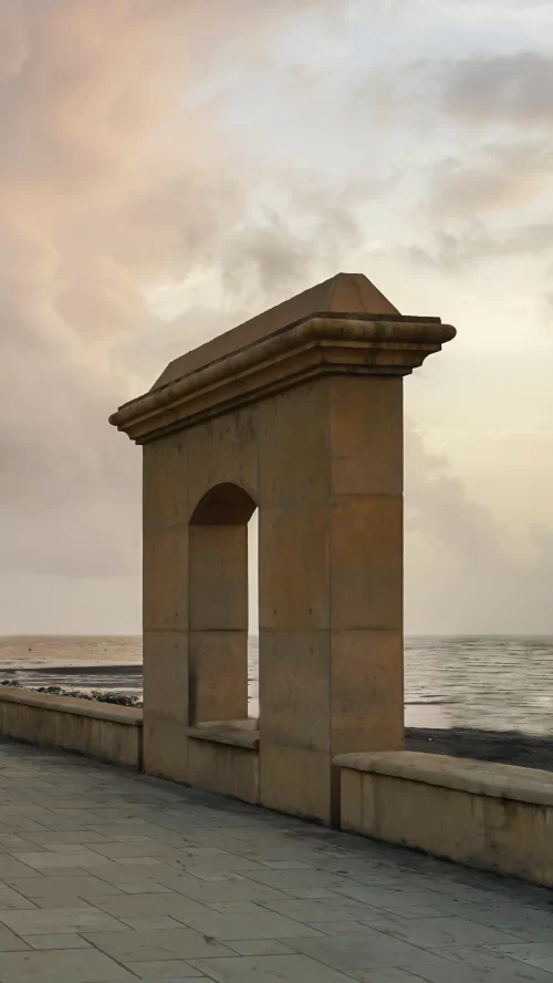 Scenic seaside promenade arch in Daman and Diu Gujarat overlooking the Arabian Sea during sunset a peaceful coastal attraction included in Gujarat tour packages