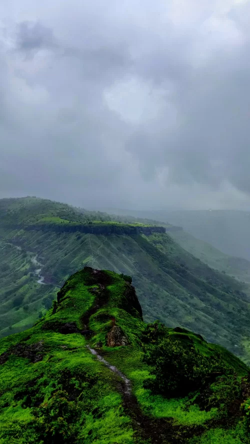 Sahyadri mountain range lush green Western Ghats landscape with misty hills and trekking trails in Maharashtra India Maharashtra tour packages