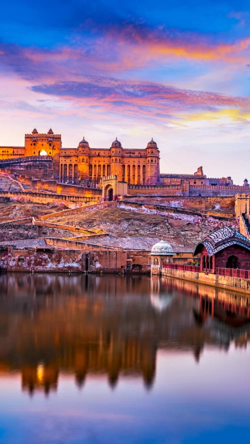 Amber Fort, Jaipur – majestic hilltop fort with Maota Lake reflection featured in Rajasthan tour packages