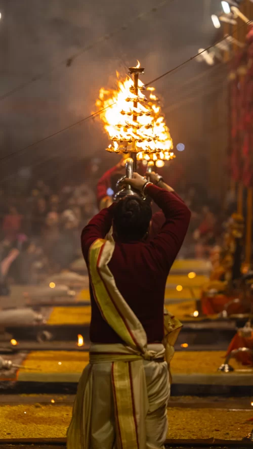 Varanasi Ganga Aarti – priest performing evening ritual at ghats featured in Uttar Pradesh tour packages