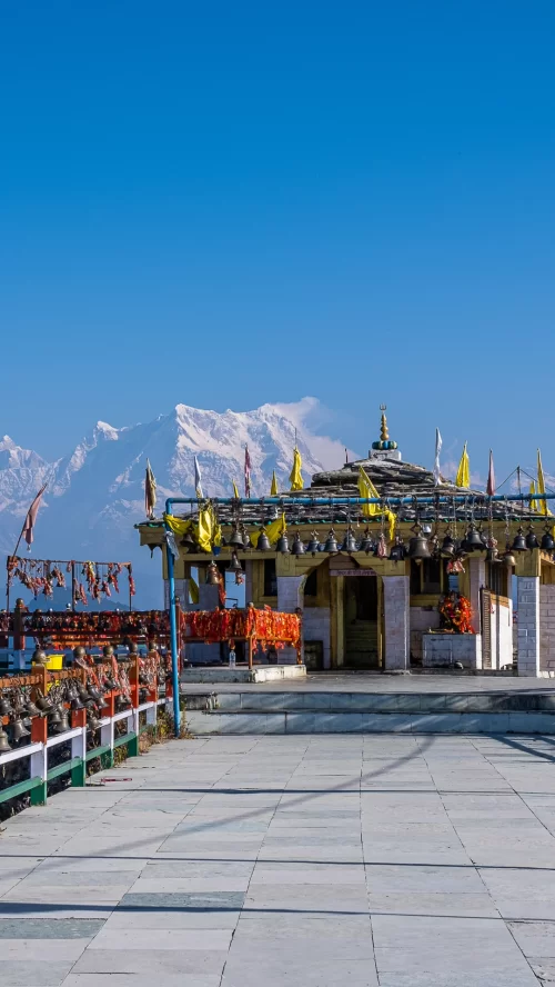 Kartik Swami Temple sacred shrine with Chaukhamba Himalayan peaks backdrop in Rudraprayag Uttarakhand tour packages.