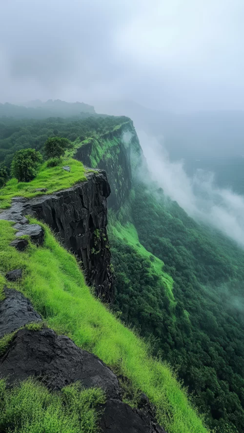 Sahyadri ranges Lonavala lush green Western Ghats cliffs with misty valley landscape in Maharashtra India Maharashtra tour packages