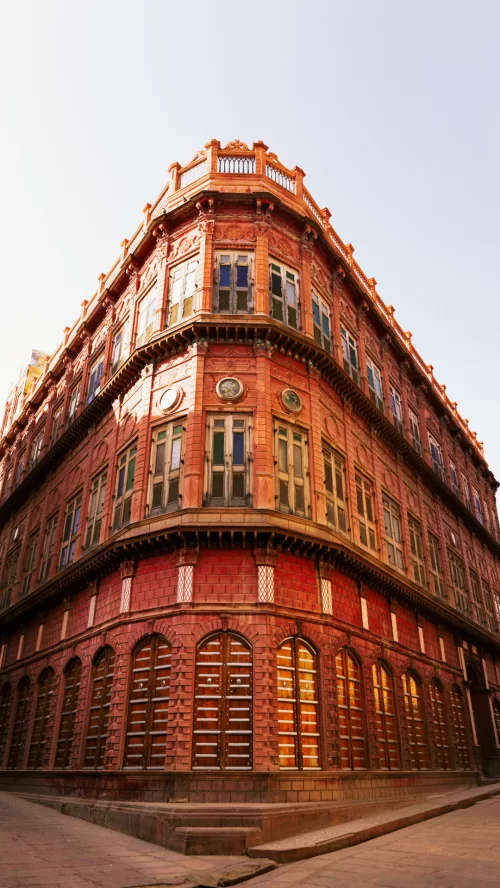 Rampuria Havelis heritage architecture in Bikaner Rajasthan at sunset, featuring red sandstone facades, perfect cultural experience Rajasthan tour package 