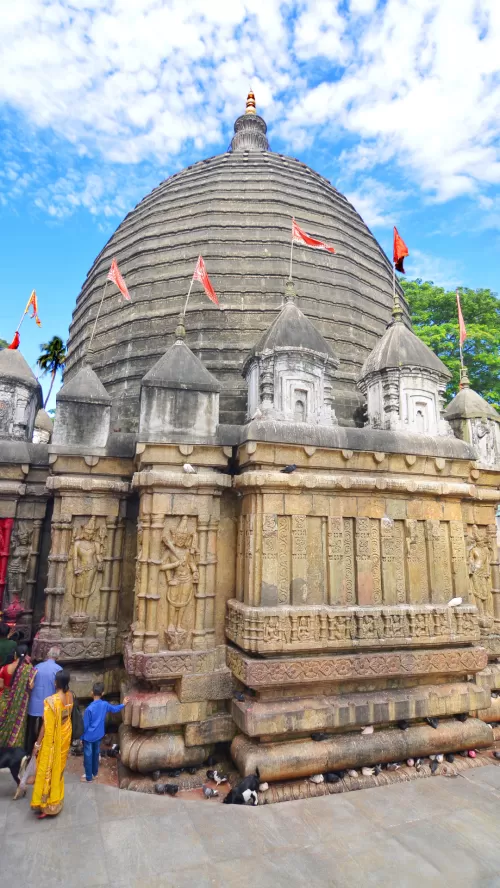 Ancient Kamakhya Temple in Guwahati Assam with traditional dome architecture and devotees visiting featured in Assam tour packages