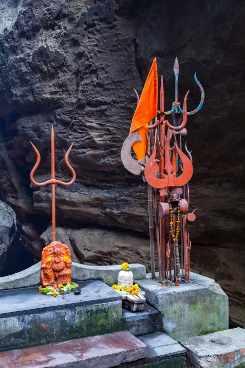 Jatashankar Cave Shiva Temple at Pachmarhi in Madhya Pradesh featuring sacred tridents and natural rock formations offering spiritual ambiance ideal for Pachmarhi sightseeing and Madhya Pradesh tour packages