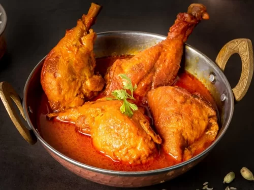 Shikara ride at Dal Lake Srinagar during sunset, featuring houseboats and mountains, romantic Srinagar tour package.