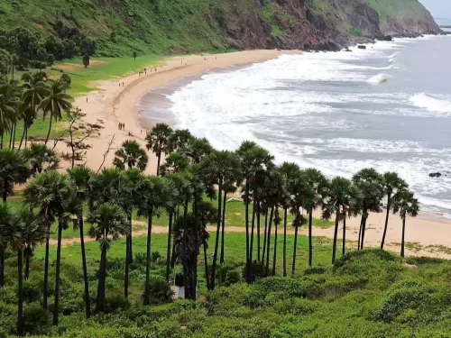Yarada Beach Visakhapatnam. Secluded scenic beach surrounded by lush hills, known for its pristine sands and tranquil atmosphere.