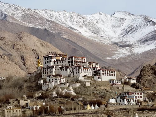 Alchi Gompa Ladakh monastery white buildings golden statue snowy mountains Indus Valley, perfect Leh Ladakh heritage trek Buddhist murals photography package. 