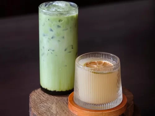 Apong drink, fermented rice millet beverage with lemon garnish, authentic Indian Arunachali tribal drink, refreshing delight.