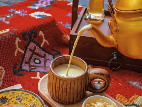 Butter Tea in creamy yak butter blend poured hot with salt, authentic Indian Ladakhi beverage, steaming hot delight.
