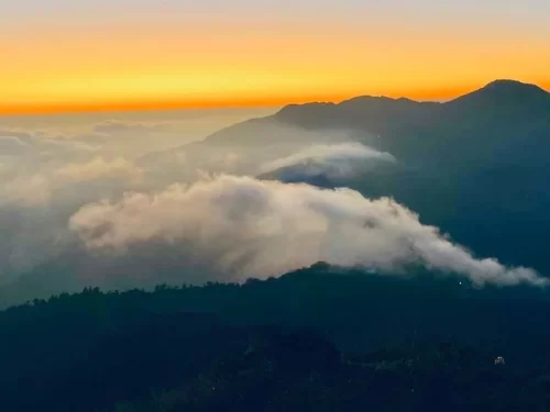 Cloud End in Mussoorie, Uttarakhand offering panoramic sunset views above rolling hills and drifting clouds, a serene viewpoint featured in Uttarakhand tour packages