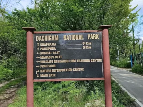 Dachigam National Park directional signboard listing Lipa beat main gate centres featured in Kashmir wildlife tour packages