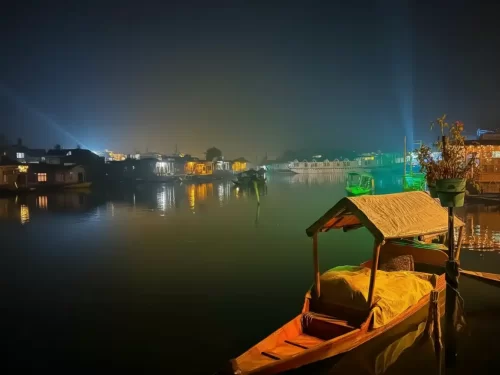 Shikara boat night lights houseboats Dal Lake Srinagar colorful reflections featured in Kashmir Srinagar tour packages