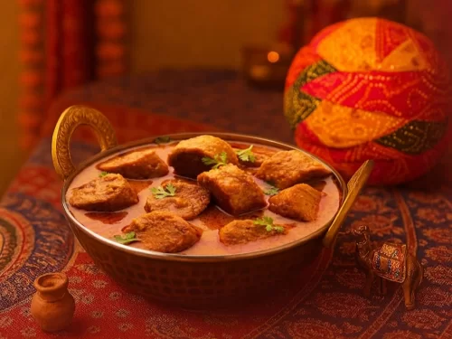 Camel safari at Jaisalmer during sunset, featuring sand dunes, perfect adventure Rajasthan tour package.