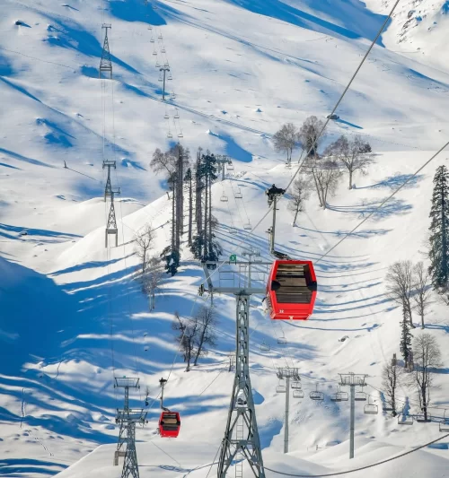 Gulmarg Gondola ride near Srinagar Kashmir over snow-covered slopes, a winter adventure highlight in Kashmir tour packages