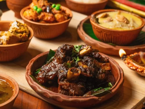 Kosha Mangsho in thick slow-cooked spicy mutton gravy with caramelized onions, authentic Indian Bengali curry, rich bold homestyle flavors.