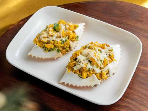 Sunset at Goa beach during evening, featuring palm trees and boats, perfect romantic experience Goa tour package.