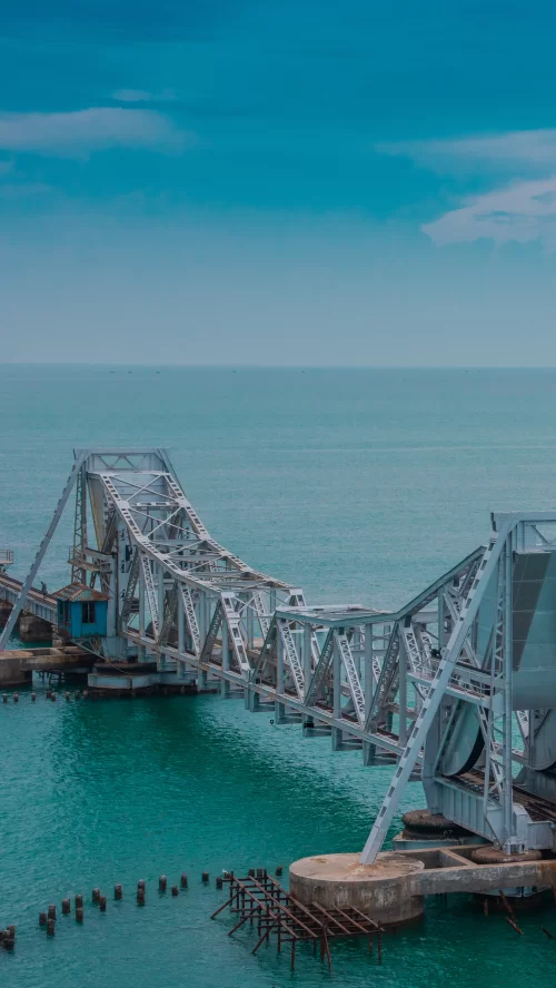 Pamban Railway Bridge stretching across turquoise waters in Rameswaram, Tamil Nadu, an iconic engineering marvel featured in Tamil Nadu tour packages.